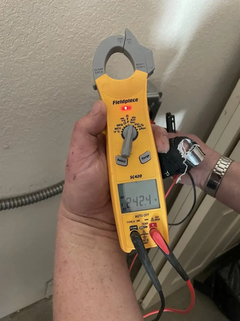 Voltage testing with clamp meter during Recessed Lighting Installation in Gaffney